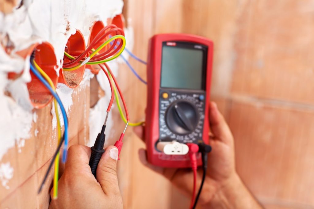 Electrician checking voltage